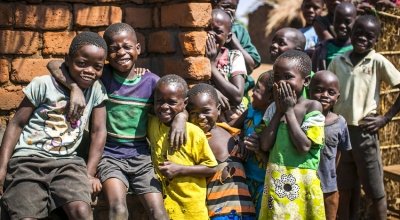 Children outside John Yamikani's family home in Malawi. Photo: Donal Skehan/Concern Worldwide.
