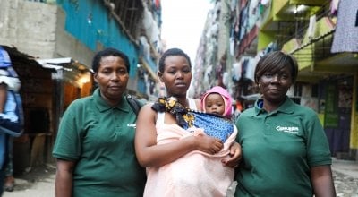 Jacqueline and her daughter Faith pictured with two Concern workers. Photo: Jennifer Nolan / Concern Worldwide.