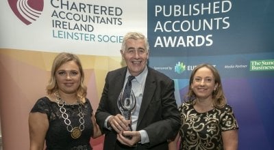 Concern CEO Dominic MacSorley with one of our many awards for our annual reports. Photo: Concern Worldwide