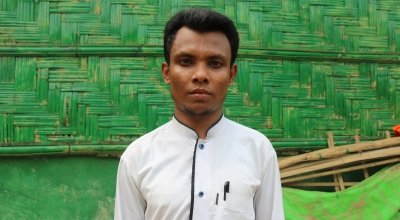Amir* has been a refugee in Bangladesh since 2017. Now we works as a volunteer for Concern, screening young children for malnutrition. Photo:  Sabrina Idris / Concern Worldwide.