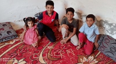 Samer* (14) with his sister Amira* and brothers Nahed* and Zeyn*. *Names changed to protect the identity of individuals. Photo: Concern Worldwide. 