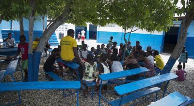 Children sitting at desks in Cité Soleil, Port au Prince, Haiti