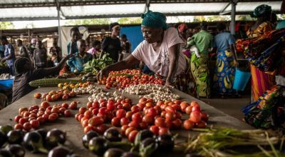 Francoise Kakuji selling her vegetables at the central market of the town of Manono, Tanganyika Province, Democratic Republic of Congo. 