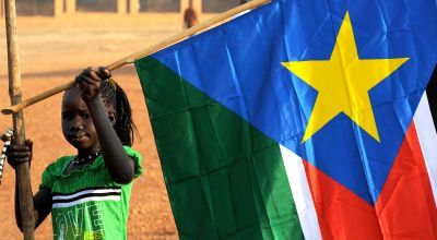 Girl with South Sudanese flag
