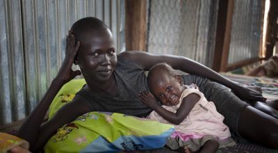 South Sudanese mother and her daughter in a protection of civilians site