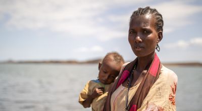 A Kenyan mother with her son in El Molo Bay, Marsabit