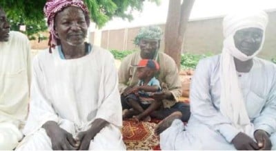 Men attending a gender transformation session, with one father looking after his child, Kadjaske village, Sila, Chad, October 2022. Photo: Justin M'pia / Concern Worldwide.