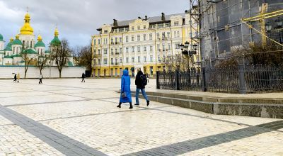 A couple walks through central Kyiv, February 2023