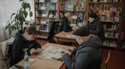 People wait to be verified so that they can receive a cash transfer from the JERU programme in Ukraine. Photo: Simona Supino/Concern Worldwide