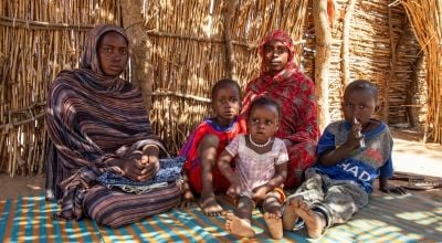 Didja, her sister and her children in a refugee camp in Chad 