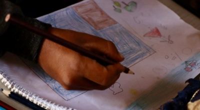 Hani (name changed) drawing on his homework