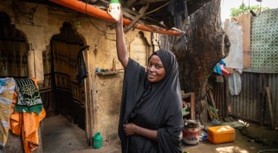 Idil* turning on the solar light she received as part of the Green graduation programme by Concern. (Photo: Mustafa Saeed/Concern Worldwide)