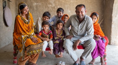 Maula Dinno and his wife and children at their home in Sindh.