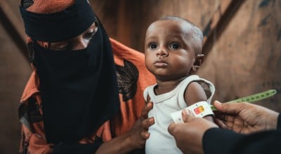 Baby Sabi* and his mother Amina*