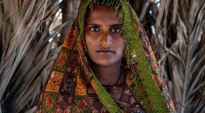 Shatro (26) standing inside her shelter in the village of Waghreji, MirpurKhas. Photo: Arif Shad/Ingenious Captures/Concern Worldwide