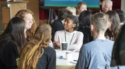 People at table discussing climate issues