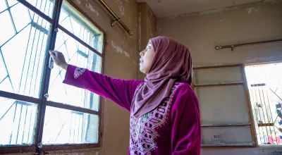 Darine* and her husband want to move where her kids can get an education. Concern has put windows in their apartment to help keep the cold out. (Photo: Gavin Douglas/Concern Worldwide)