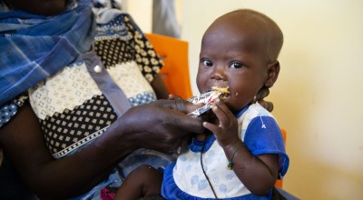 Tahani* receiving RUTF at Concern-supported clinic in Sudan