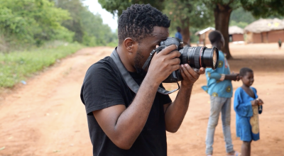 Mussa Uwitonze photographing in the field