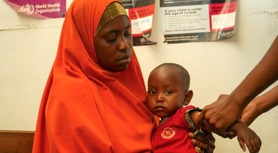 Amburo* (28) holds her youngest child Abshir*. Amburo is a mother of four children from Baidoa, now living in a displacement camp in Daynile District, Mogadishu. Photo: Adnan Mohamed/Concern Worldwide