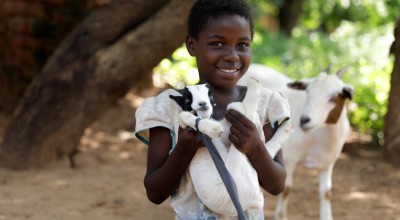 Omega (9) with her goat in Mchiliko, Nsanje. Photo: Jon Hozier-Byrne/Concern Worldwide