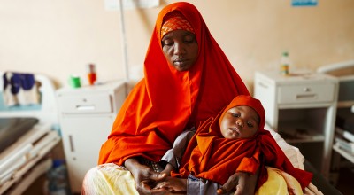 Halima* (40) and her baby Shukri* attend their local health centre. Halima* lives in Igadabagey IDP site in Marka with her five children (3 boys and 2 girls). Halima* was a farmer in Lower Shabelle area but Halima* and her family were displaced after the drought and moved to the IDP site in 2022. Photo: Adnan Mohamed/Concern Worldwide