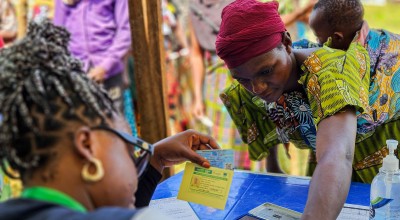 Participants are registered at the verification desk before proceeding to the distribution points. Photo: Samuel Isenge/Concern Worldwide