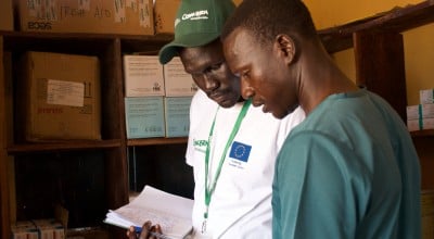 Health and Nutrition Manager Luka Malek Mur and Health Facility Officer checking registers in Northern Bahr al Ghazal, South Sudan. Photo: Hannah Bolder/Concern Worldwide