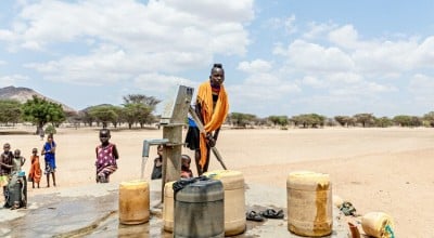 Children pump water at a tap in Kangalita., Kenya. The region has been severely affected by drought. Photo: Natalia Jidovanu/Concern Worldwide.