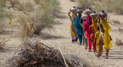 Community women carrying water in mud pots from the communal well  Umerkot district Sindh province Pakistan  April 2017  (00000003).jpg