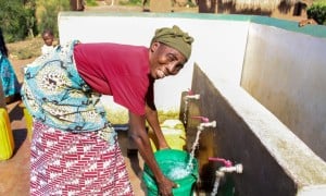 A Concern programme participant gathers water