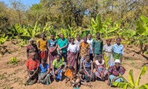 Concern Malawi Team standing with banana sucker recipients in Traditional Authority Ndamera in Nsanje District. Photo: Concern Worldwide.