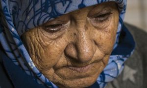 "Iman" lost 19 members of her family, including her husband, all of her children except one daughter, and all of her grandchildren except one grandson in a bombing attack on their home in Syria. Photo: Kieran McConville / Concern Worldwide. 