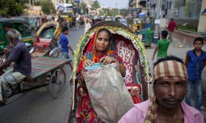 Nazma returns from selling food at local offices in Dhaka, Bangladesh. Photo: Abbie Trayler-Smith / Concern Worldwide. 