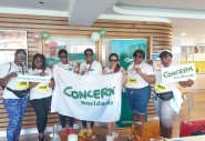 Group of women holding Concern banner