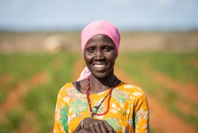 Mumina Mohamed on irrigated plot of maize next to her home in Subo village