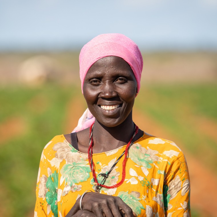 Mumina Mohamed on irrigated plot of maize next to her home in Subo village